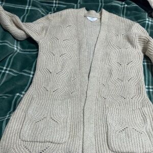 Long cardigan with lacy detailing, 2 pockets. Very little pilling.